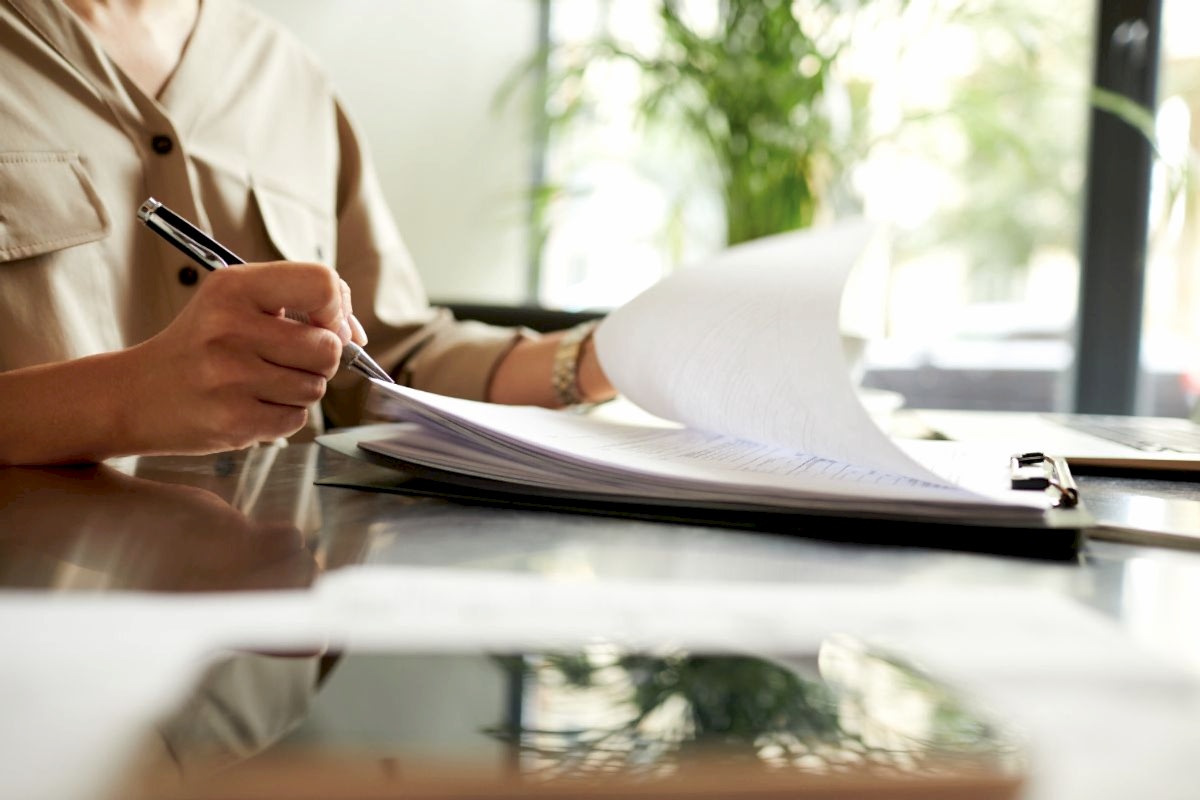 woman filling out birth certificate request application